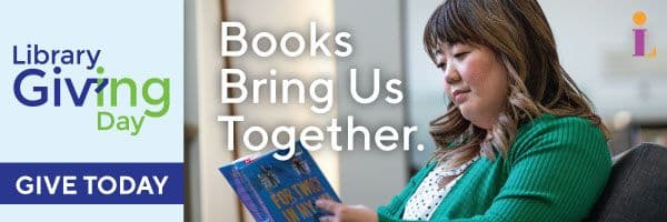 A woman reads a book in a library. Text on image: “Library Giving Day. Books Bring Us Together. Give Today.”.